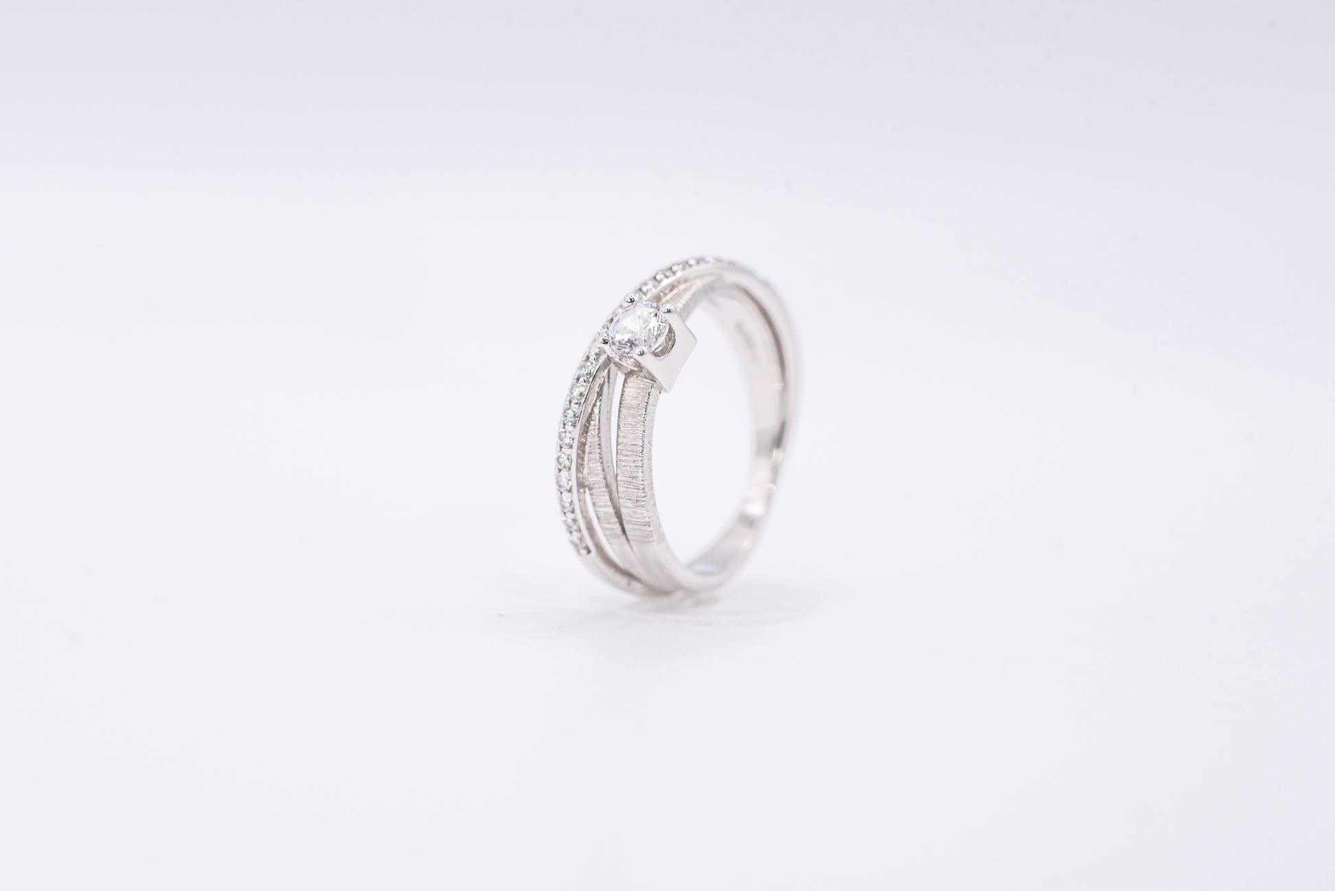 Silver ring with gemstones on a white background