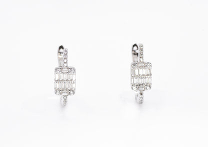 Pair of diamond earrings on a white background