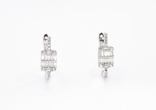 Pair of diamond earrings on a white background
