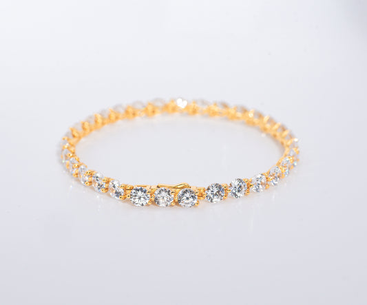 Gold color bracelet with multiple gemstones on a white background