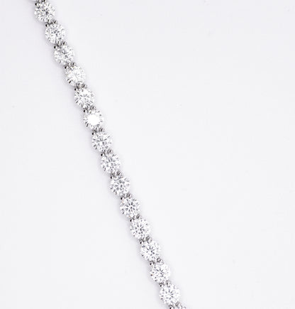 Silver bracelet with multiple gemstones on a white background