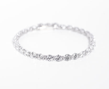 Silver bracelet with multiple gemstones on a white background