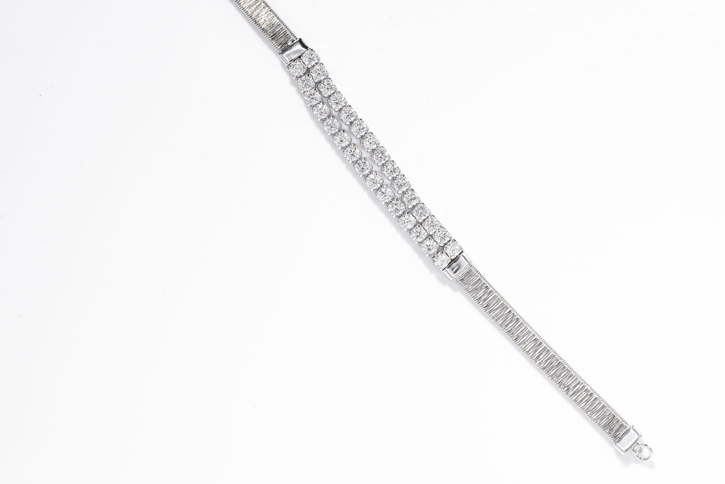 Silver bracelet with clear gemstones on a white background