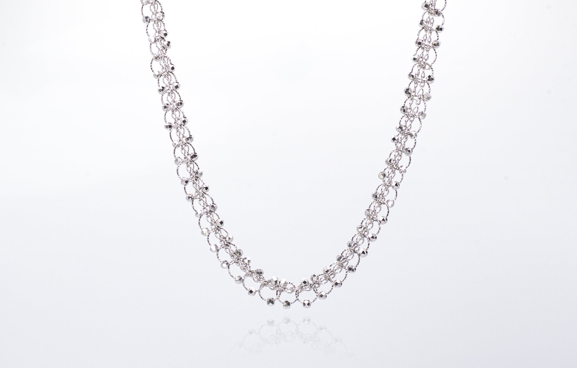 Silver chain necklace on a white background