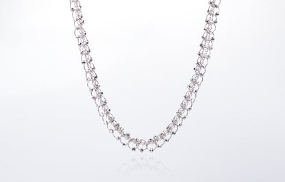 Silver chain necklace on a white background