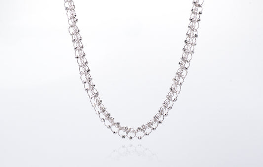 Silver chain necklace on a white background