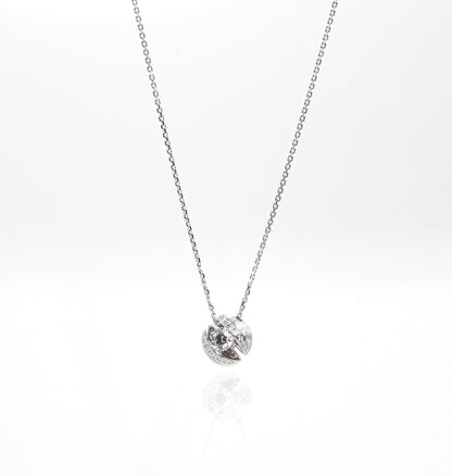 Silver necklace with a small round pendant on a white background