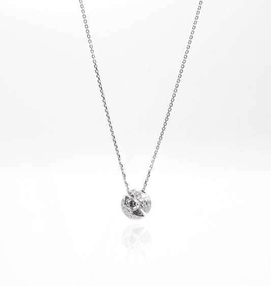 Silver necklace with a small round pendant on a white background
