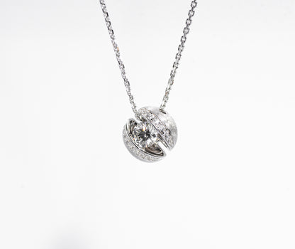 Silver necklace with a round pendant on a white background