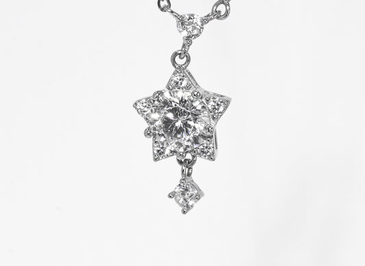 Star-shaped diamond pendant on a white background
