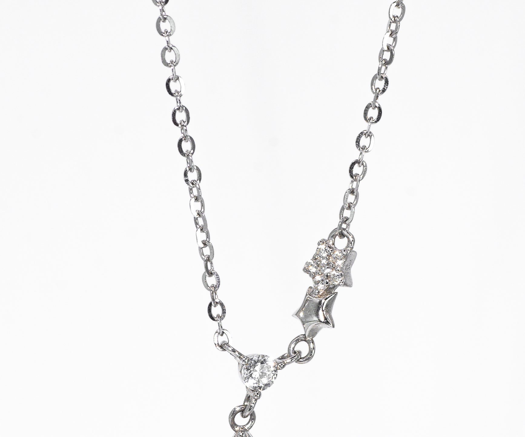 Silver necklace with a pendant on a white background