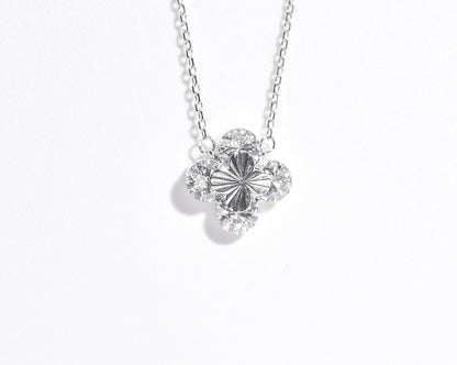 Silver necklace with a floral pendant on a white background