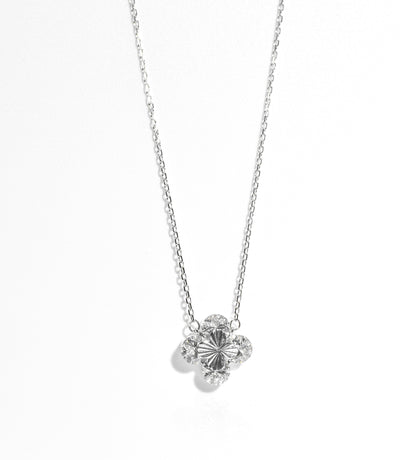 Silver necklace with a floral pendant on a white background