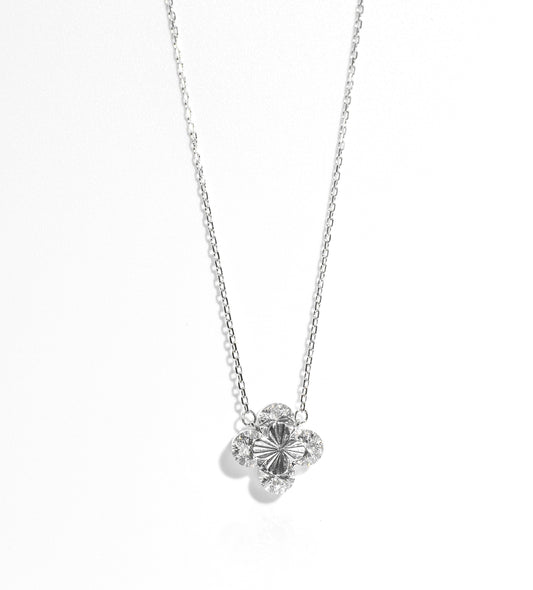 Silver necklace with a floral pendant on a white background