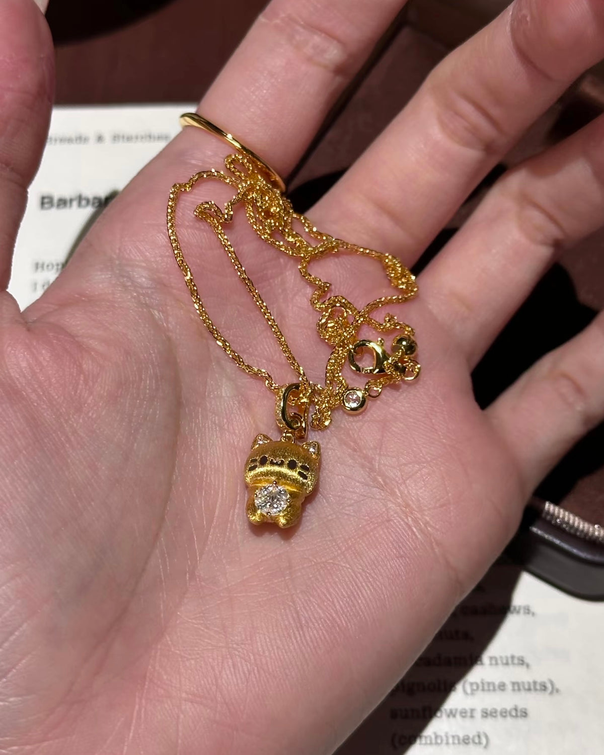 Lunelle Atelier Lucky Cat convertible charm pendant necklace with adjustable chain and gold-tone finish.