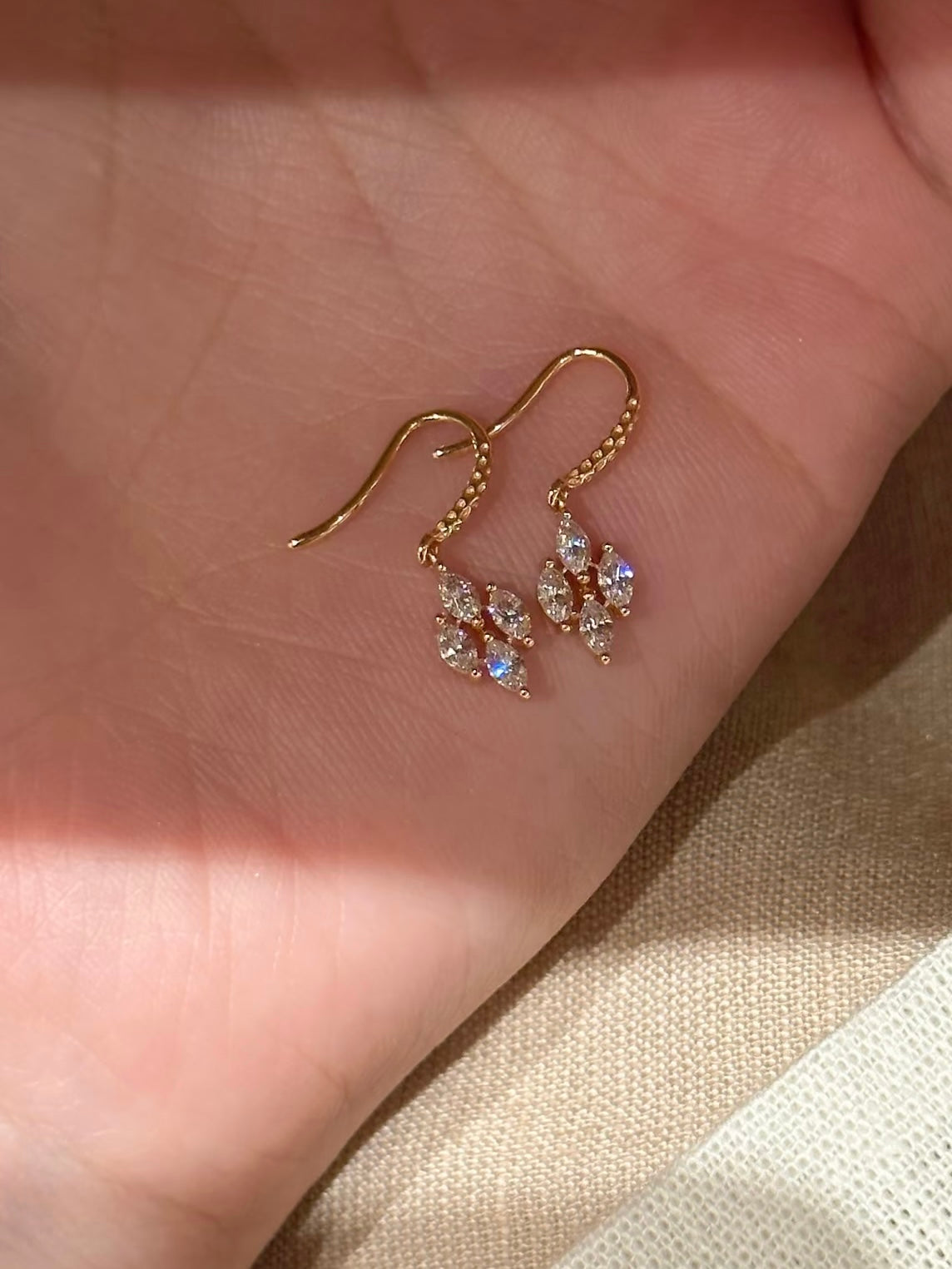 Lunelle Atelier dainty marquise cluster hook earrings featuring multiple marquise-shaped gemstones on silver hooks