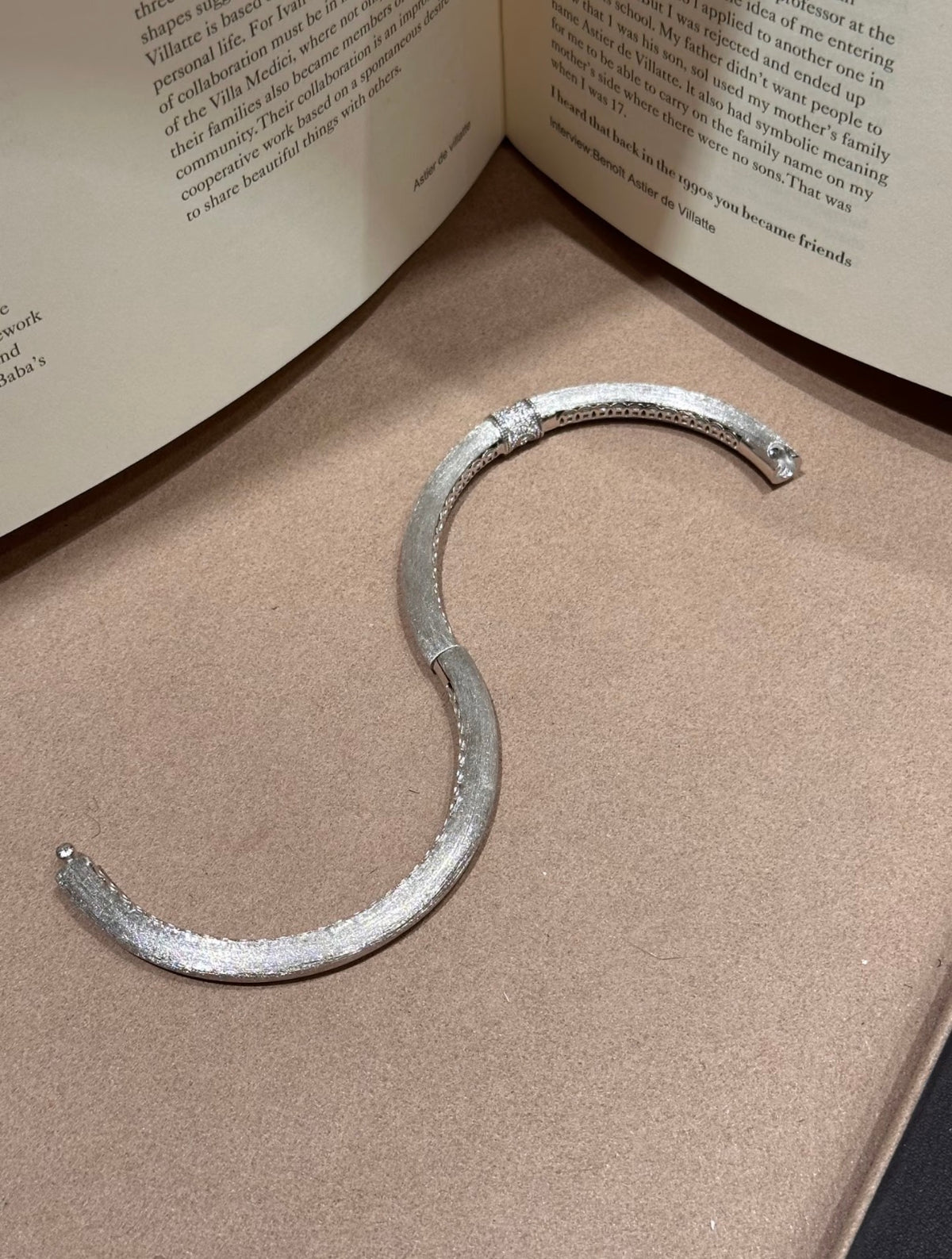 Hand-brushed rotating accent bangle bracelet by Lunelle Atelier featuring a sleek, modern design and polished finish.