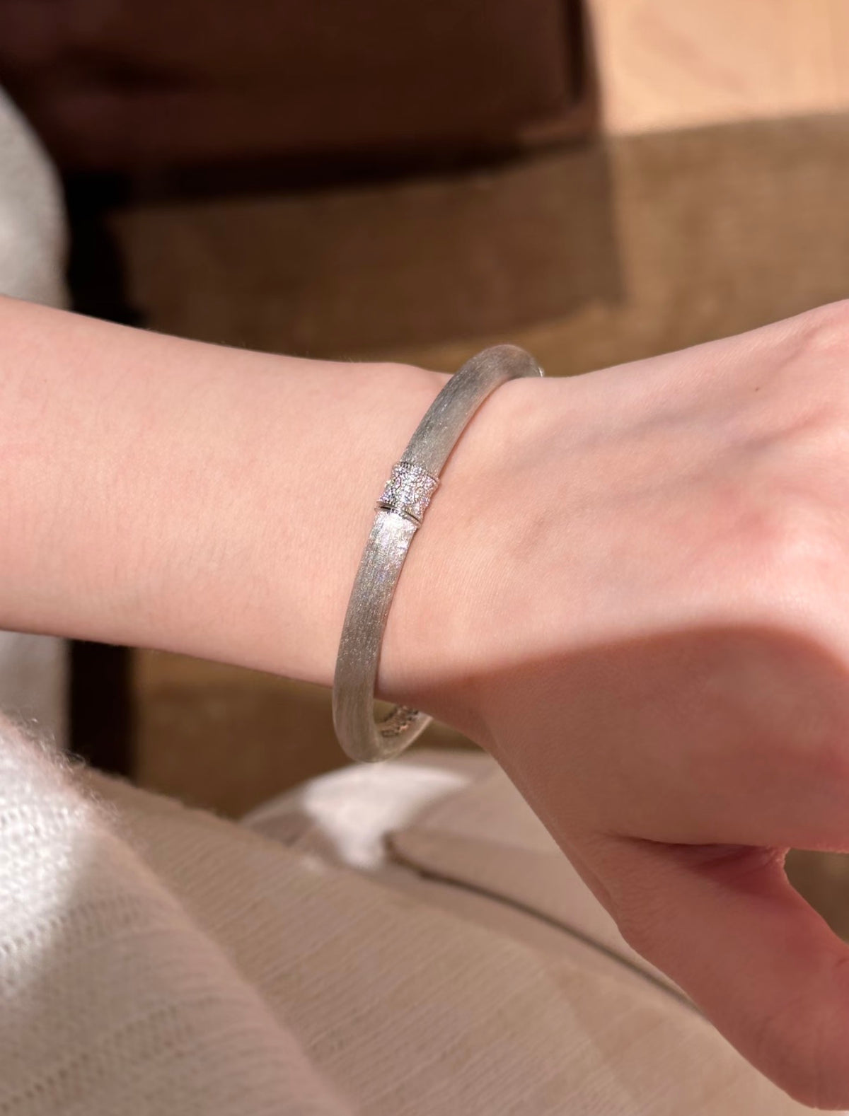 Lunelle Atelier hand-brushed rotating accent bracelet with sleek, modern design and smooth finish, displayed on a neutral background.