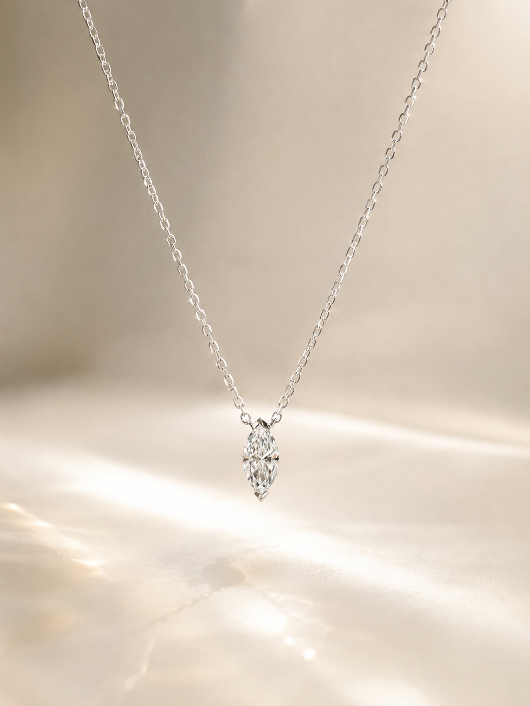 Lab-grown marquise solitaire necklace by Lunelle Atelier featuring a sparkling marquise-cut gemstone on a delicate chain.
