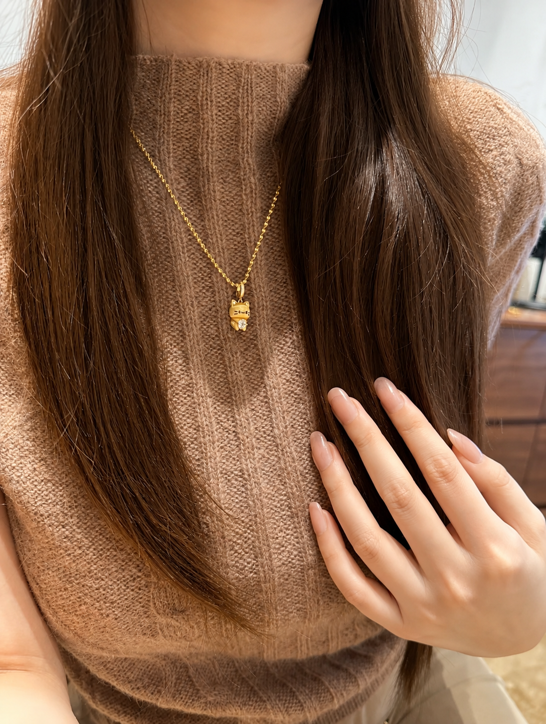 Lunelle Atelier Lucky Cat convertible charm pendant necklace featuring a playful cat design with a charm that can be worn or removed.