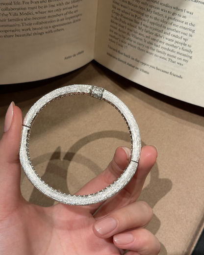 Hand-brushed rotating accent bangle bracelet by Lunelle Atelier with textured finish and sleek design.