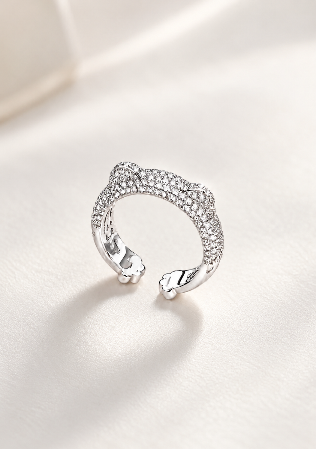 Lunelle Atelier cat paw pavé band ring featuring a delicate design with small sparkling paw-shaped accents on a silver band