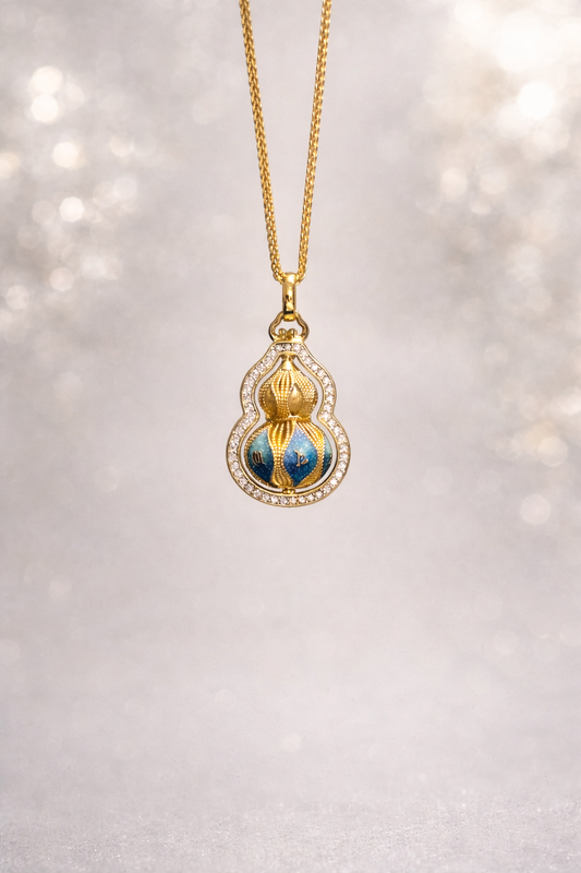 Gold necklace with a decorative pendant on a light background