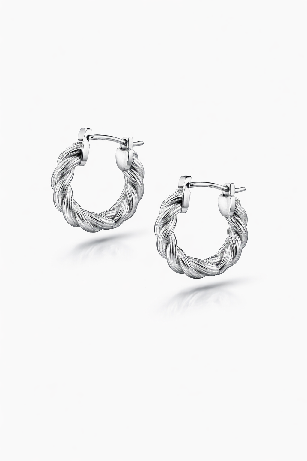 Pair of silver hoop earrings on a white background