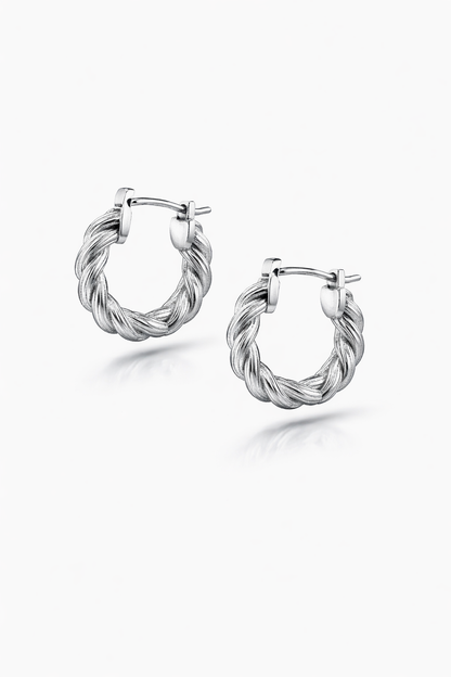 Pair of silver hoop earrings on a white background