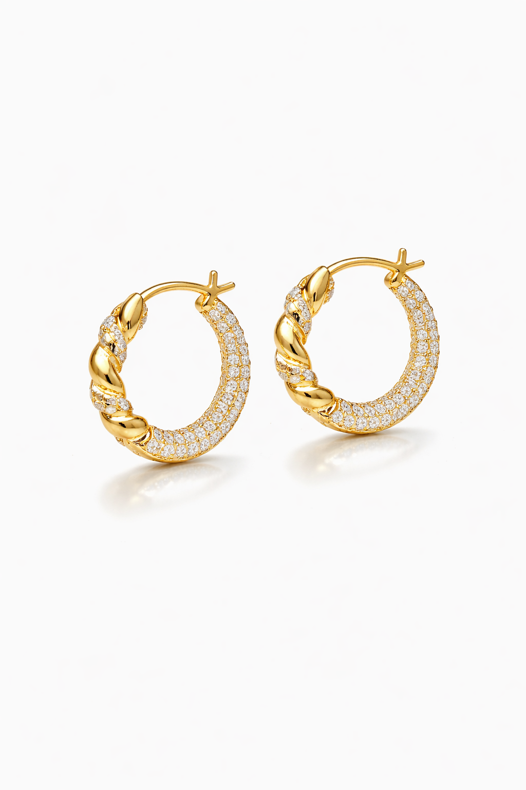 Gold hoop earrings with diamond accents on a white background