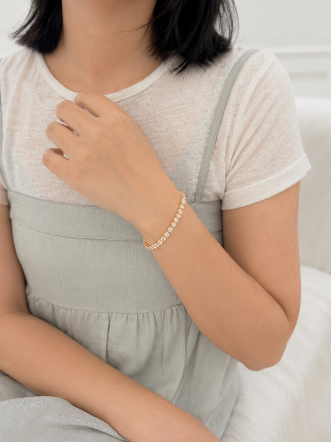 Lunelle Atelier floating round-cut tennis bracelet with sparkling gemstones on a delicate silver chain.