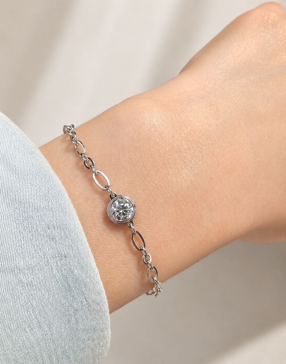 Lunelle Atelier adjustable bezel single bubble moissanite chain bracelet with delicate links and sparkling gemstone accents.