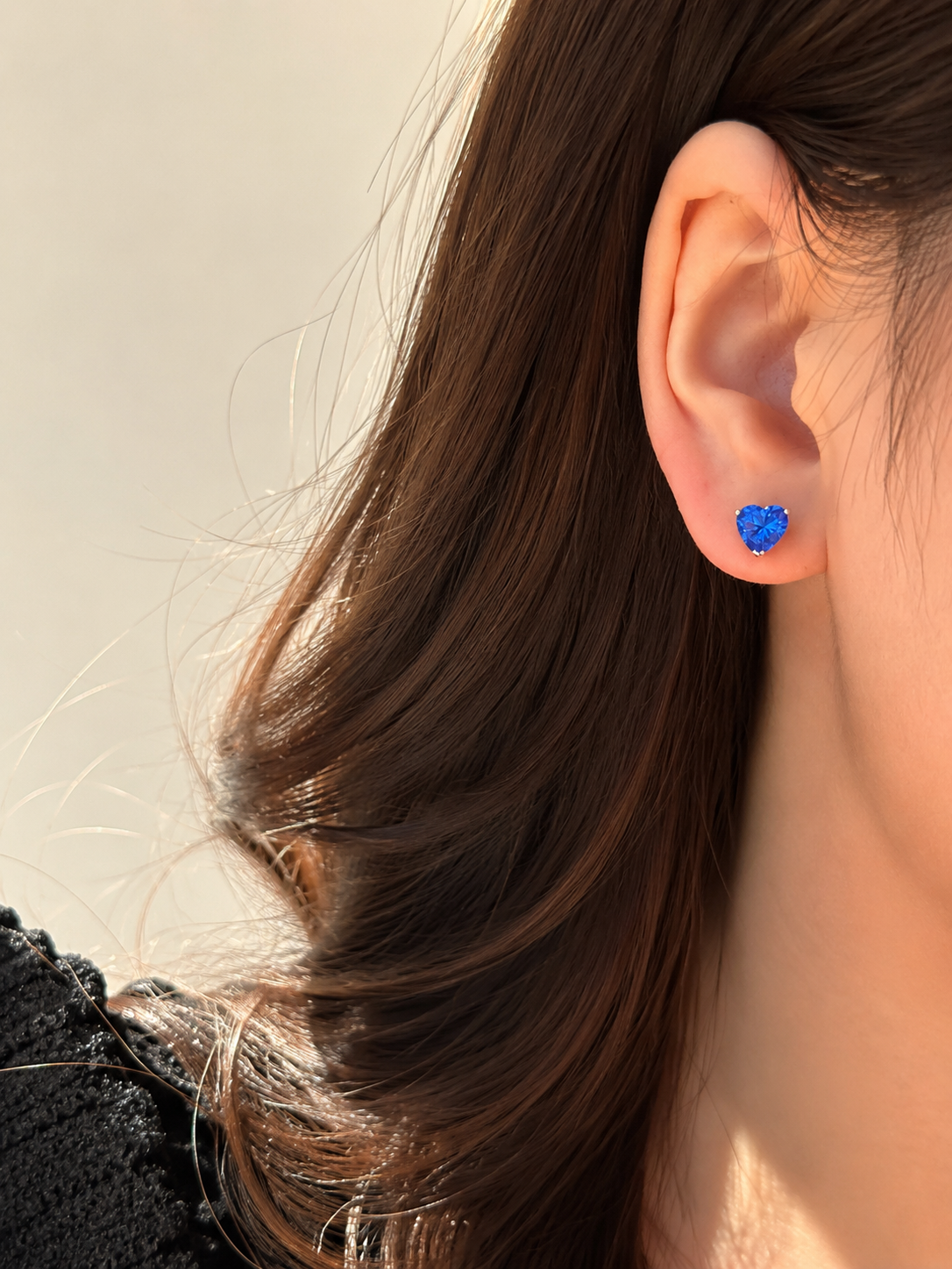 Lunelle Atelier Heart Glow gemstone stud earrings with sparkling pink gemstones on silver posts, close-up view.