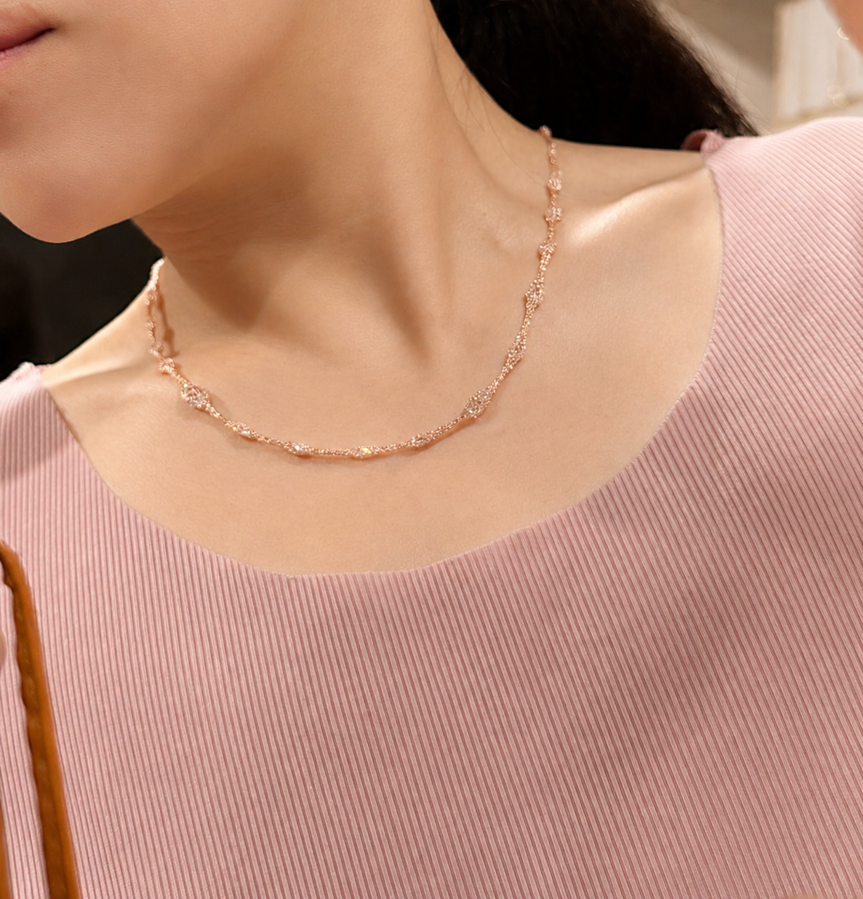 Lunelle Atelier Veil of Light woven necklace featuring intricate beadwork and delicate design on a neutral background.