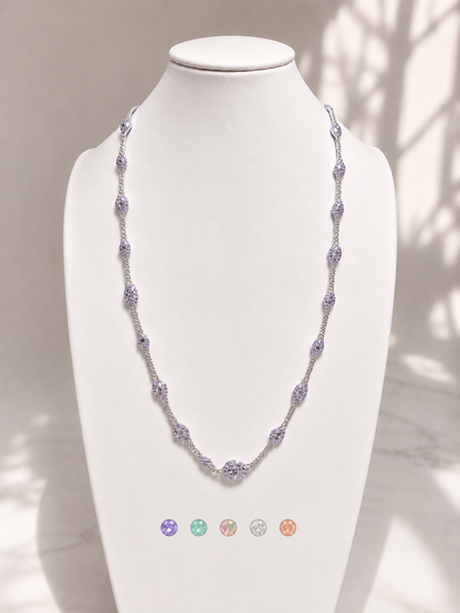 Lunelle Atelier Veil of Light woven necklace featuring delicate, intricate design with shimmering light-reflecting details.