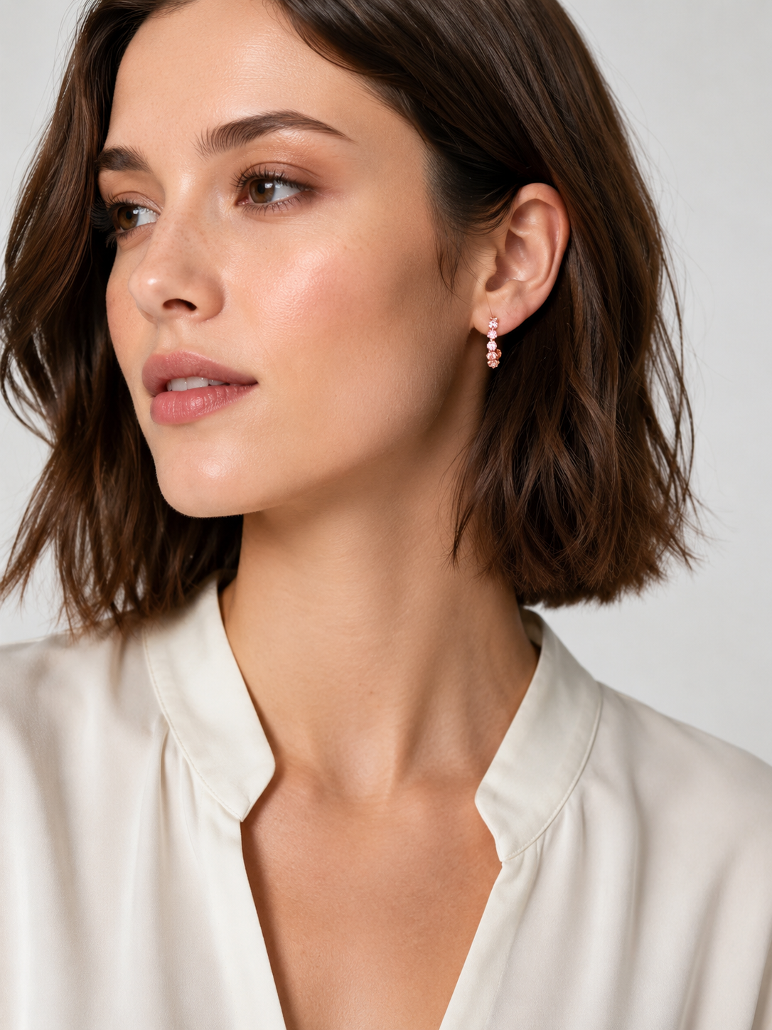 Lunelle Atelier floating round-cut tennis half hoop earrings in sterling silver with sparkling gemstone accents.