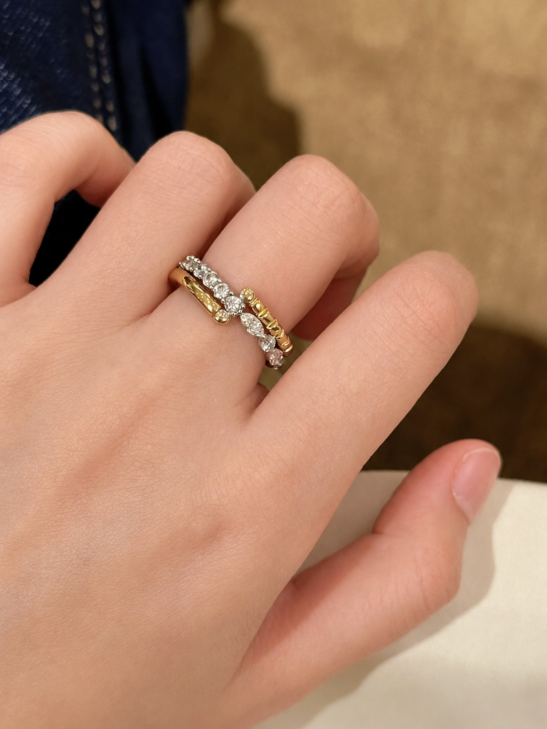 Lunelle Atelier Pivot Multi-Band Convertible Ring showing overlapping gold bands and adjustable design on a white background.