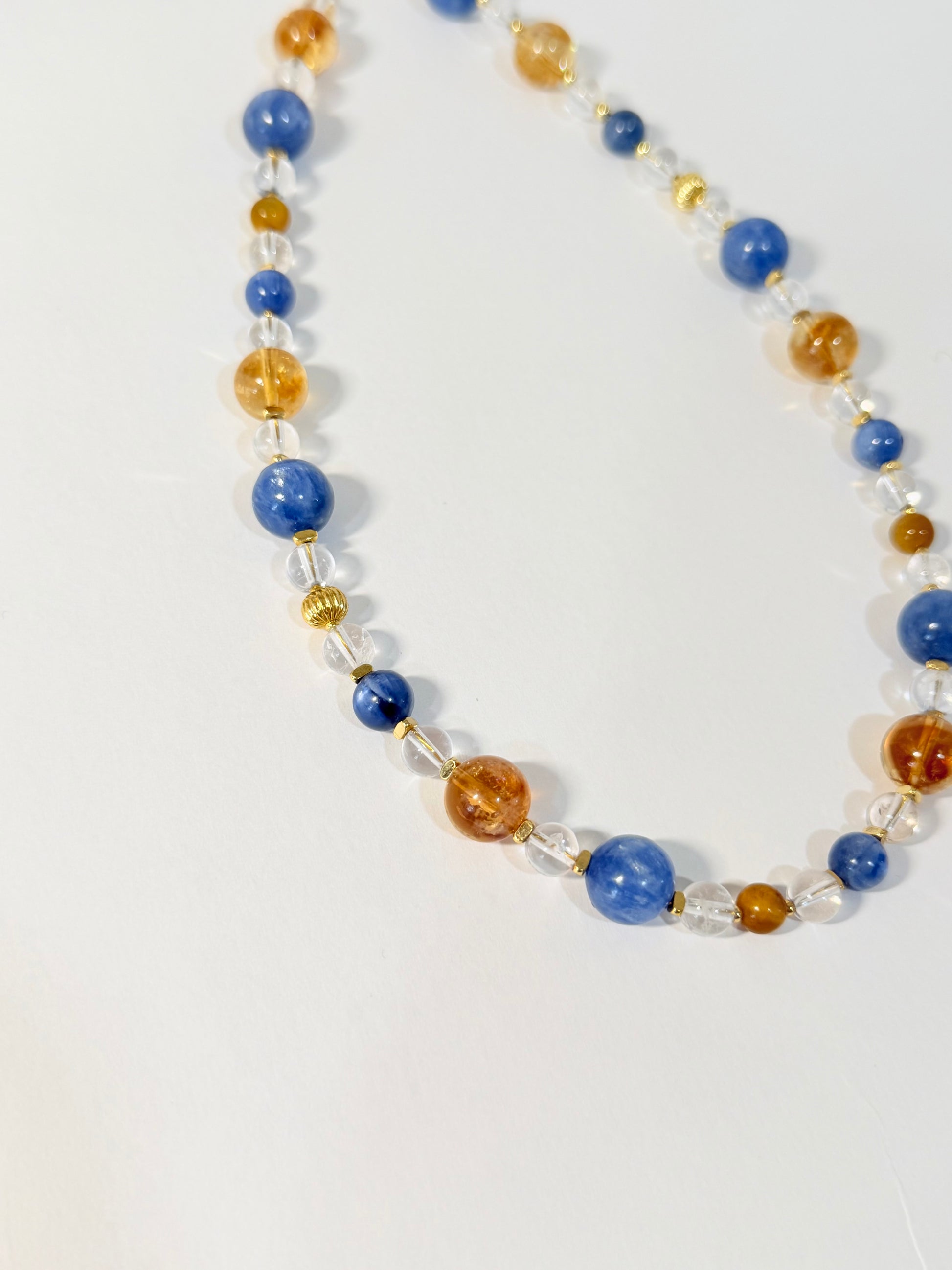 Necklace with multicolored beads on a white background