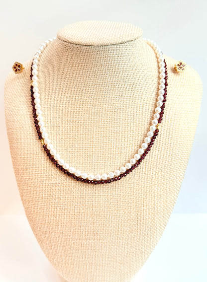 Two-layered pearl necklace on a mannequin bust against a white background