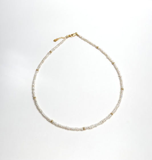 Lunelle beaded freshwater pearl necklace with gold and silver S925 sterling silver clasp and delicate pearl beads.