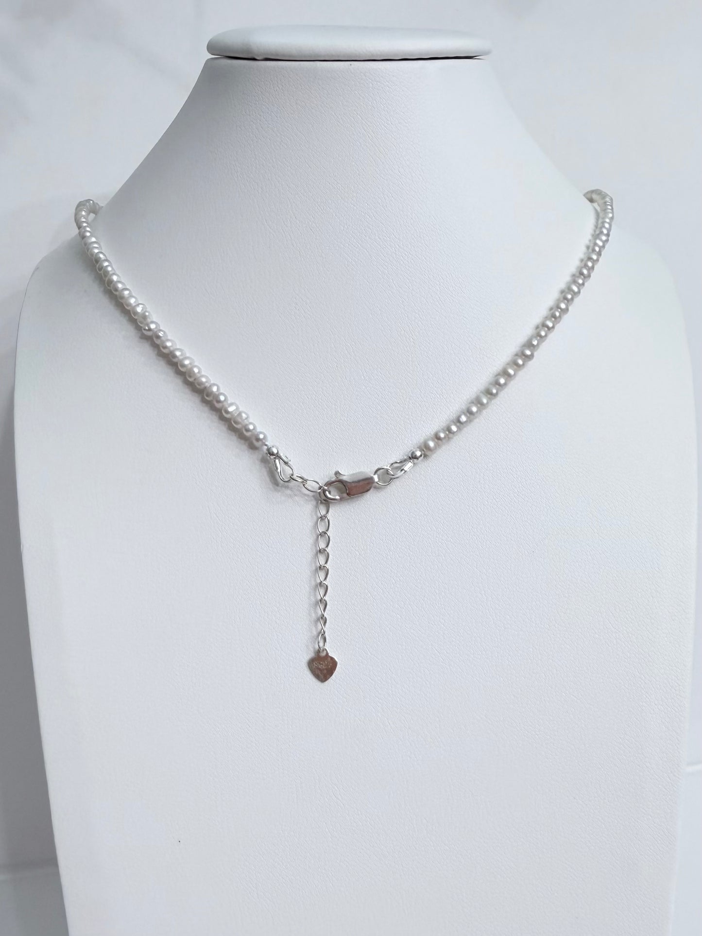 Lunelle by Heart and Hand mini freshwater pearl necklace with a delicate pearl strand and silver clasp.