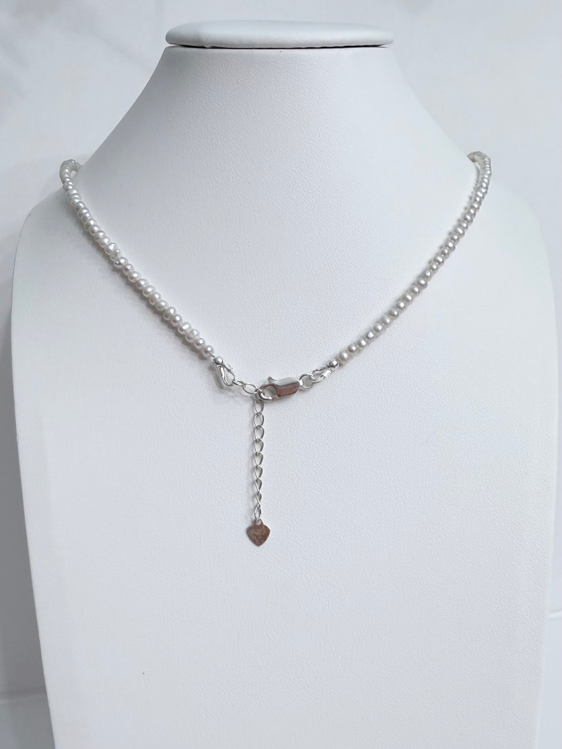 Lunelle by Heart and Hand mini freshwater pearl necklace with a delicate pearl strand and silver clasp.