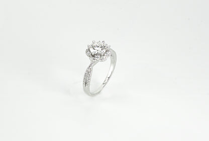 Silver ring with a diamond on a white background