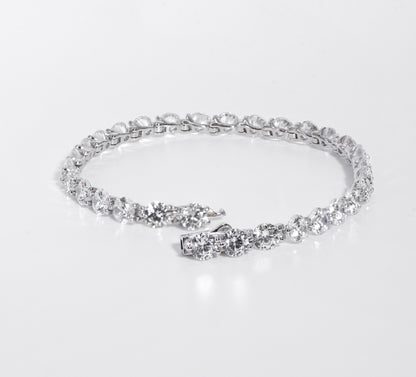 Silver bracelet with multiple gemstones on a white background