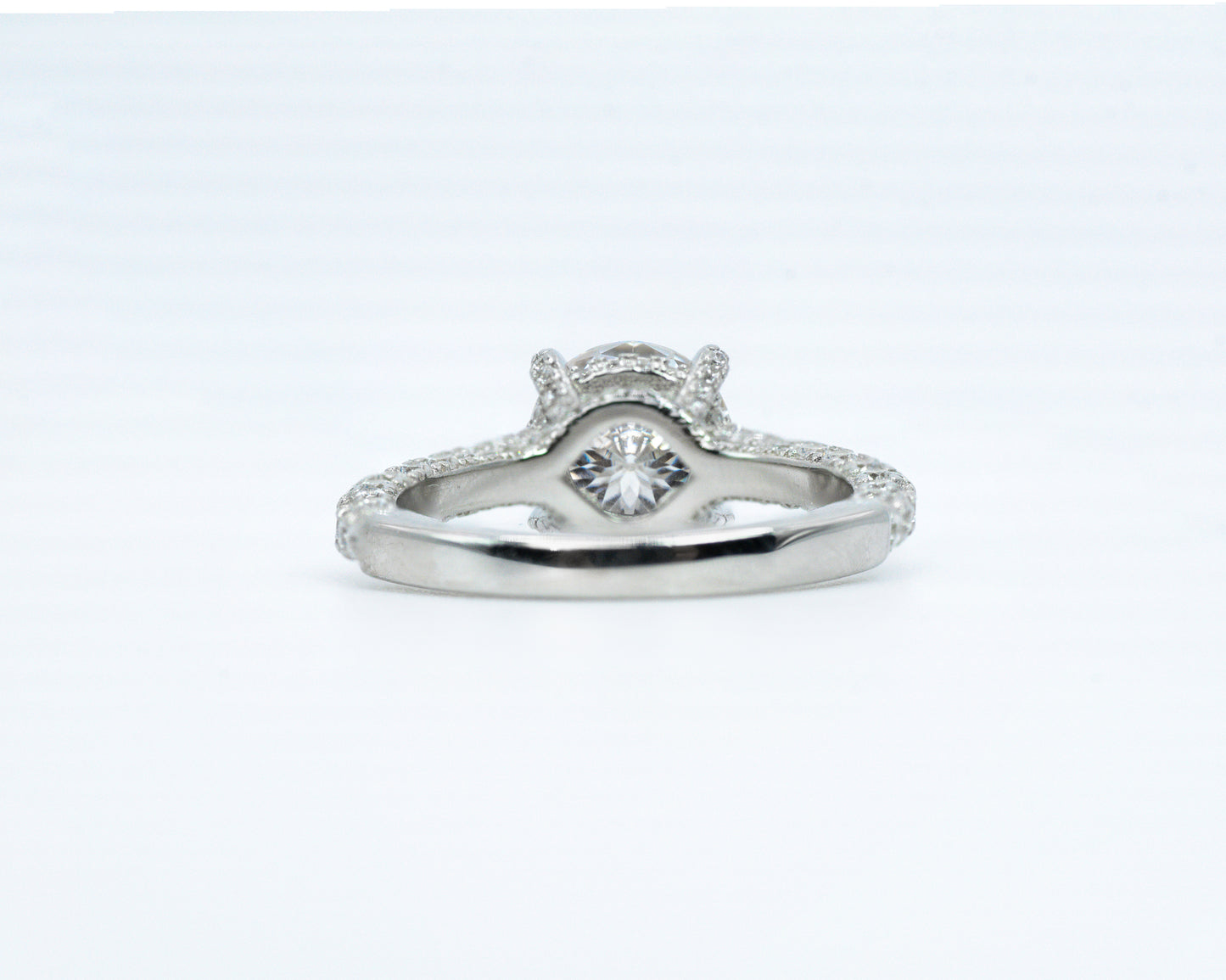Silver ring with a diamond on a white background