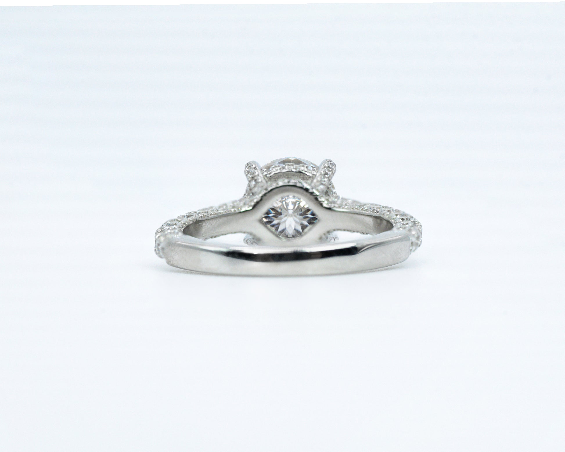 Silver ring with a diamond on a white background