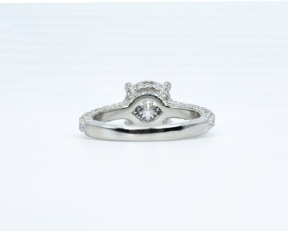 Silver ring with a diamond on a white background