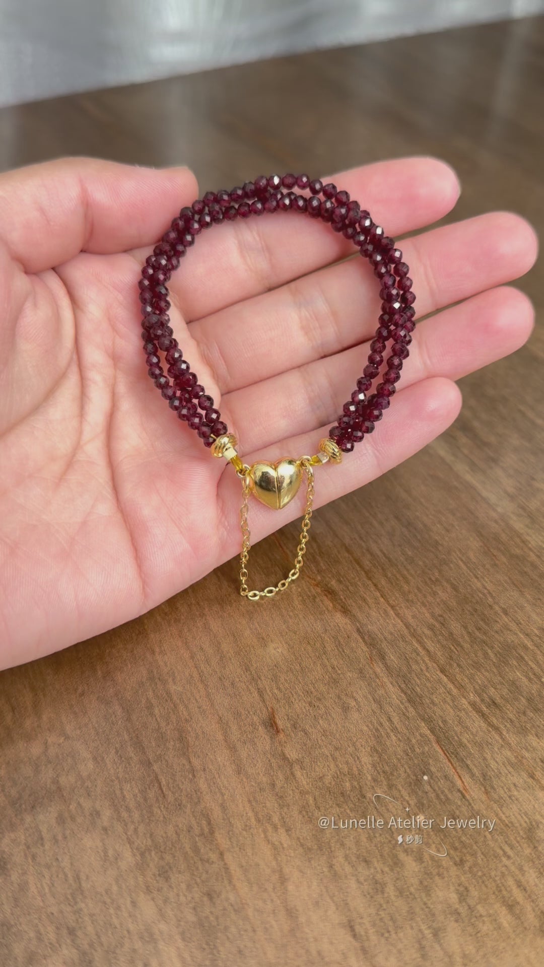 Multi-stand faceted garnet bracelet with heart-shaped magnetic claps